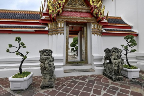 Stone statues of Chinese warriors, guardians, Wat Pho, Temple of the Reclining Buddha, Bangkok,