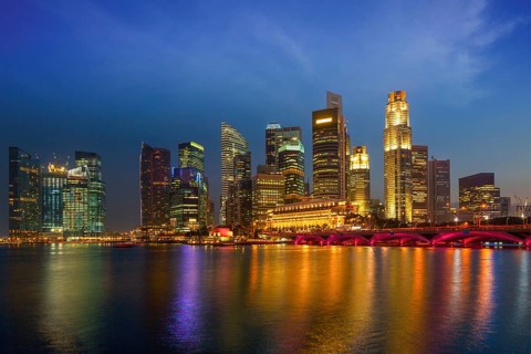 Singapore skyline and Marina Bay in evening