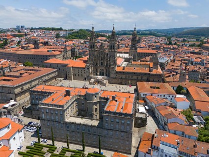The cathedral is at the centre of the cityscape, surrounded by several historic buildings with