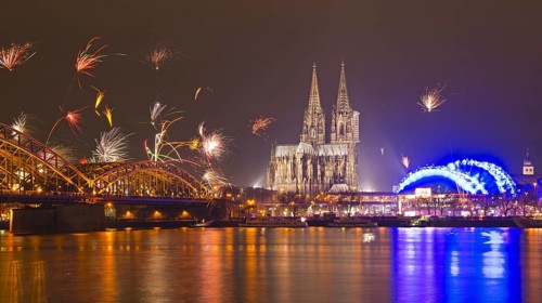 New Year's Eve fireworks, Hohenzollernbruecke with cathedral and Musical Dome, Rheinufer, Cologne,