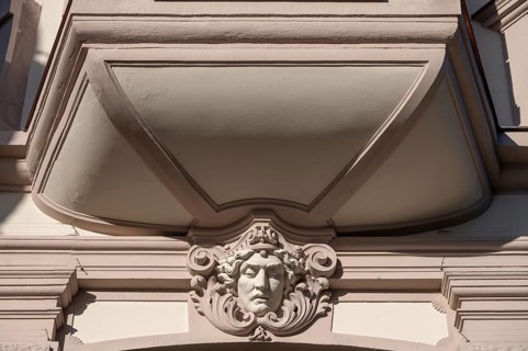 Relief of a head under a historic bay window, Würzburg, Lower Franconia, Bavaria, Germany, Europe