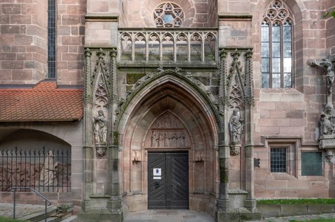 Main entrance portal of St Nicholas and St Ulrich Church, nave built around 1400, Kirchenberg 15,