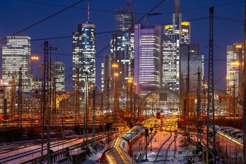 Railway tracks in front of the main railway station in Frankfurt am Main, skyline of skyscrapers in