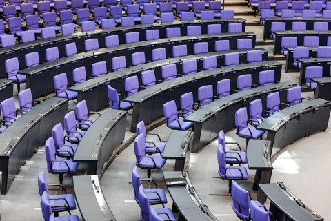 Empty plenary chamber in the German Bundestag, equipped with office swivel chairs in the special