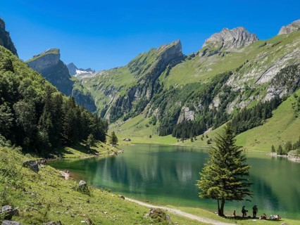 Lake Seealpsee, Alpstein mountain range near Wasserauen, peak of Mt. Säntis in the back, Appenzell,