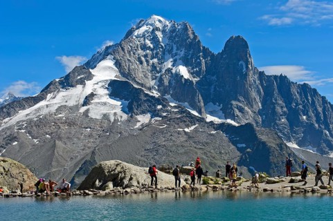 At the Lac Blanc mountain lake, with the Aiguille Verte and Aiguille du Dru peaks behind, Chamonix,