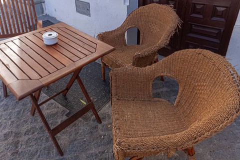 Table and chairs in the outdoor catering area, Vejer, Andalusia, Spain, Europe