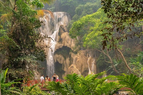 Tourists at Kuang Si waterfall near Luang Prabang, Laos, Asia