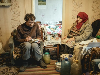Varvara, 85, and her son Leonid, 56. Leonid looks after his mother, who is in need of care. She