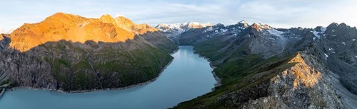 Alpine panorama with Pigne d'Arolla, Lac de Dix, sunset in the mountains, reservoir, Valais Alps,