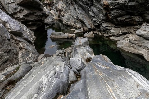 Rocks, granite rock formations in the Maggia River near Ponte Brolla, in the Maggia Valley, Valle