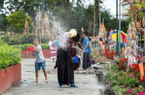 NAMSAI, INDIA.- APRIL 16: Devotees celebrate the vibrant Sangken Festival by pouring water over