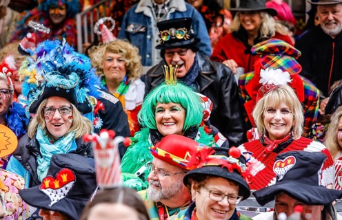 Colourfully costumed carnivalists celebrate carnival in Cologne, on Weiberfastnacht the street