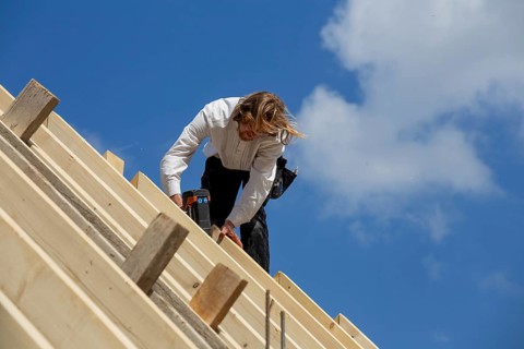 Carpenters working on the roof of a new building in the Rhein-Pfalz district