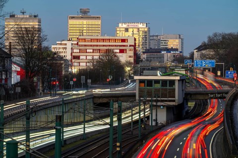 Motorway A40, Ruhr expressway, heavy traffic jam, rush hour, city passage in Essen, skyline of the