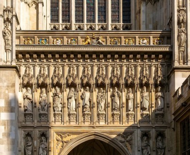 Carved stonework frieze above entrance door, Westminster abbey church, Westminster, London,