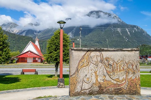 Relief of an indigenous woman and church in the village of Chaiten, Pumalin-Douglas Tompkins