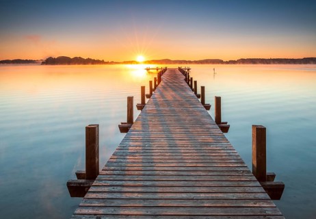 Jetty at Wörthsee at sunrise, fog on the water, Bavaria, Germany, Europe