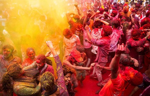 Revellers smear with Gulal or coloured powder and dance to play Holi, the Hindu spring festival of