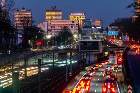 Motorway A40, Ruhr expressway, heavy traffic jam, rush hour, city passage in Essen, skyline of the