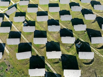 Rows of solar panels at a photovoltaic plant near town of Espejo. Aerial view. Drone shot. Córdoba