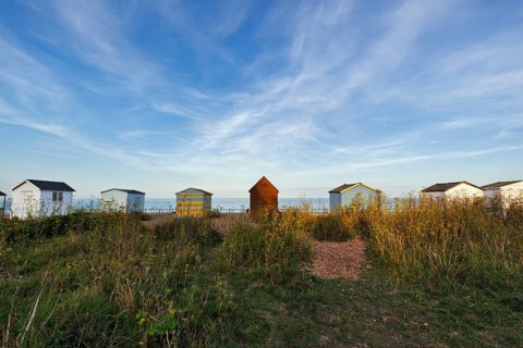 Colourful beach huts on a shingle beach, Cirrus, Kingsdown Beach, English Channel, Dover, Kent,