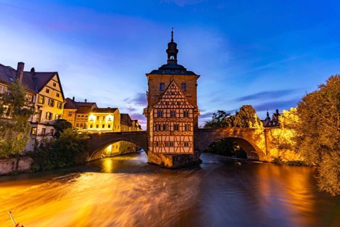 The Old Town Hall in the river Regnitz at dusk, Old Town of Bamberg, Upper Franconia, Bavaria,