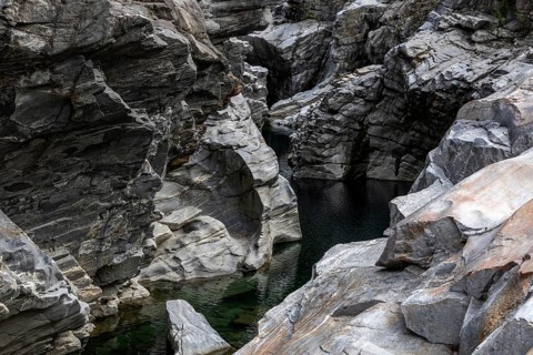 Rocks, granite rock formations in the Maggia River near Ponte Brolla, in the Maggia Valley, Valle