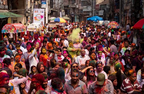 Revellers smear with Gulal or coloured powder and dance to play Holi, the Hindu spring festival of