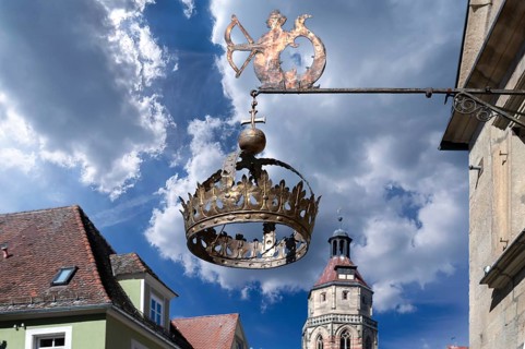 Nose sign of the Hotel Restaurant Krone, 15th century, Rosenstraße 10, behind the tower of the