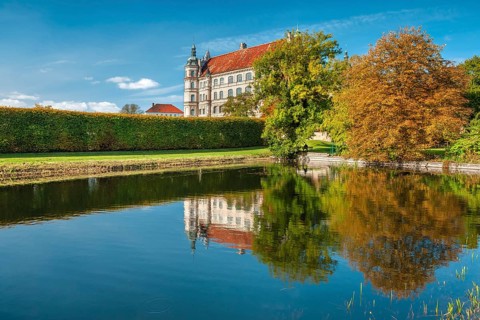 Güstrow Castle in autumn with water spouting, built in the 16th century, Renaissance building,