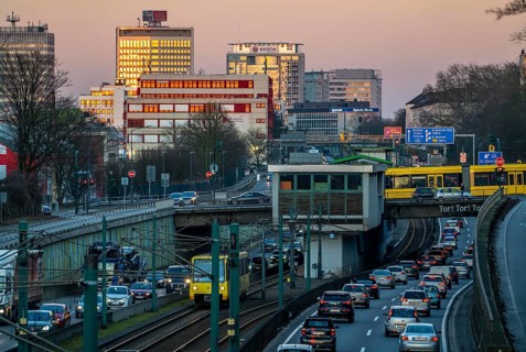 Motorway A40, Ruhr expressway, heavy traffic jam, rush hour, city passage in Essen, skyline of the
