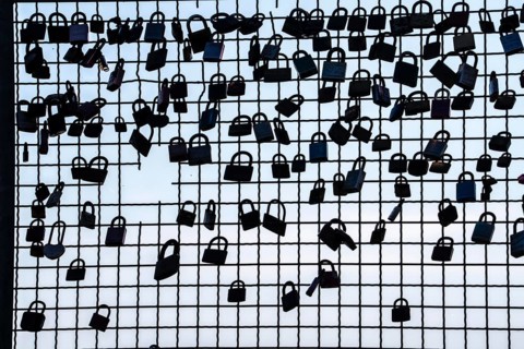 Padlocks, so-called love locks on a fence, vantage point in Wesel am Rhein, North Rhine-Westphalia,