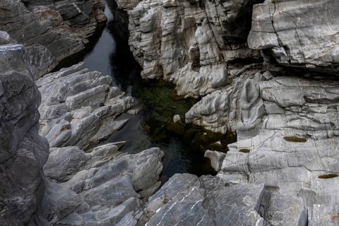 Rocks, granite rock formations in the Maggia River near Ponte Brolla, in the Maggia Valley, Valle