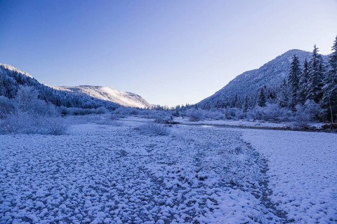 Isar valley in winter at temperatures of minus 18 degrees Celsius. Snow covered landscape with the