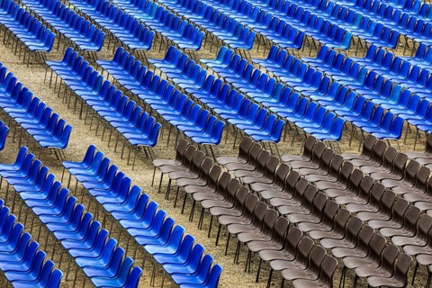 Blue and black rows of chairs in the audience area of the summer festival in Lucca, Tuscany, Italy,