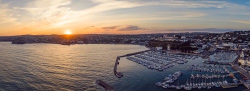 Sunset over Torquay Harbour and Marina, English Riviera from a drone, Devon, England, United