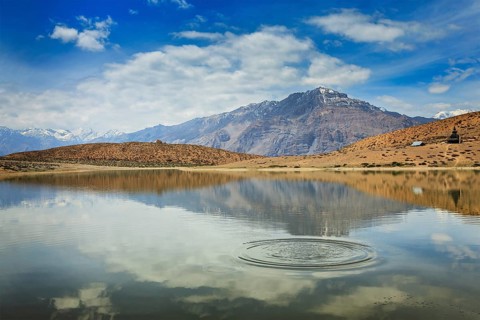 Himalayas mountains refelcting in mountain lake Dhankar Lake. Spiti Valley, Himachal Pradesh,