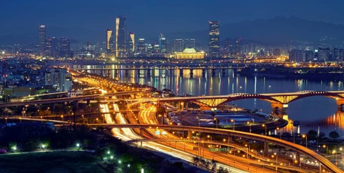 Aerial panorama of Seoul downtown cityscape and Seongsan bridge over Han River in twilight. Seoul,