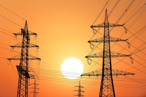Overhead power lines, high-voltage pylons, power lines, setting sun, sunset, Baden-Württemberg