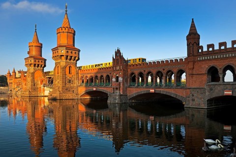 Oberbaum Bridge over the Spree with yellow underground, Friedrichshain-Kreuzberg district, Berlin,