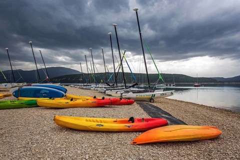 Boats on the beach in Sainte Croix du Verdon, Lac de Sainte-Croix, thunderstorm atmosphere,