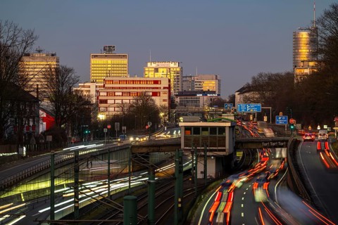 Motorway A40, Ruhr expressway, heavy traffic jam, rush hour, city passage in Essen, skyline of the