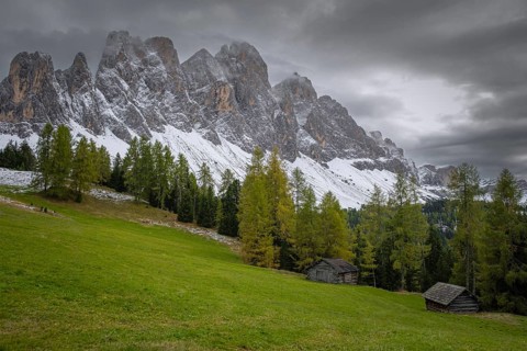 View of a part of the Geisler group in the foreground two mountain huts, Dolomites, snow,