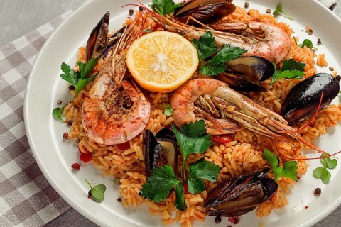 Seafood paella, shrimp and mussels risotto, rice, homemade, top view, no people
