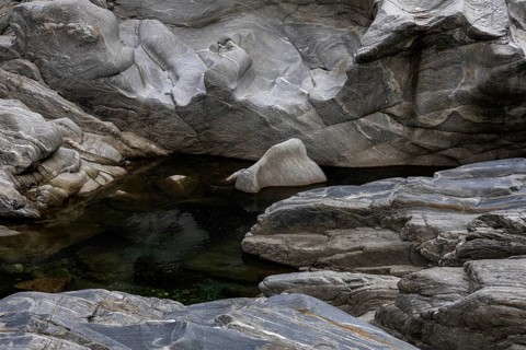 Rocks, granite rock formations in the Maggia River near Ponte Brolla, in the Maggia Valley, Valle
