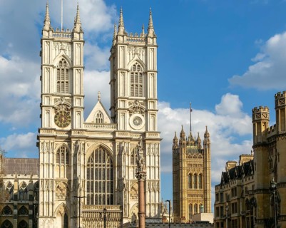 Towers and frontage of Westminster abbey church with Victoria Tower in background, Westminster,