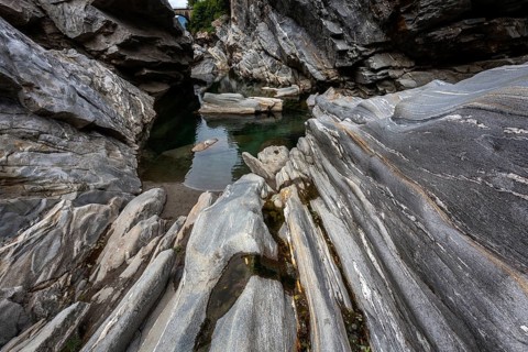 Rocks, granite rock formations in the Maggia River near Ponte Brolla, in the Maggia Valley, Valle