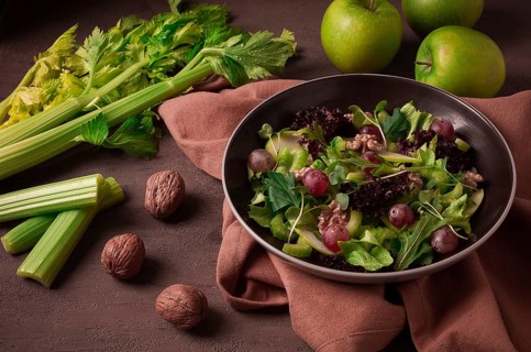 Fresh, Waldorf salad, celery stalk with chicken, apple and walnut, grapes, herbs, homemade, no