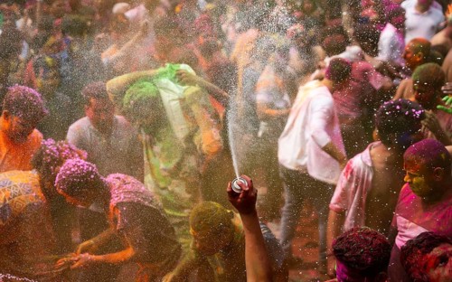 Revellers smear with Gulal or coloured powder and dance to play Holi, the Hindu spring festival of